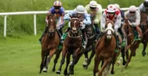 galloping race horses and jockeys racing