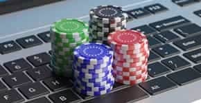 Casino poker chips stacks on a computer laptop